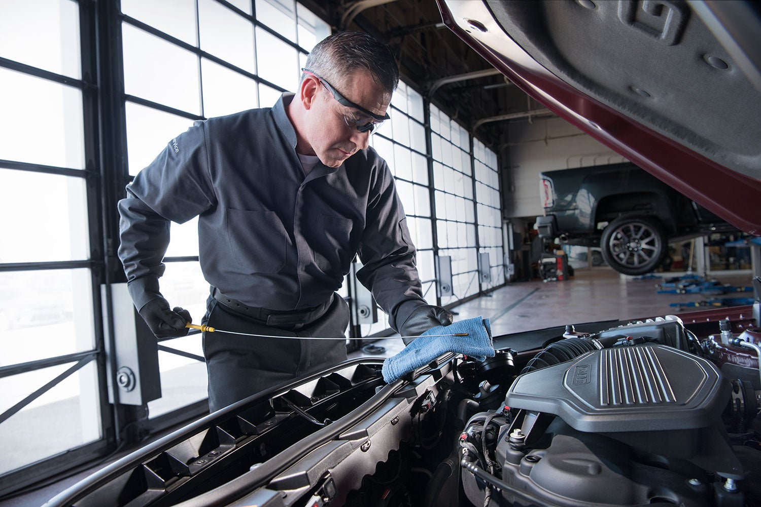 Buick service technician performs repairs.