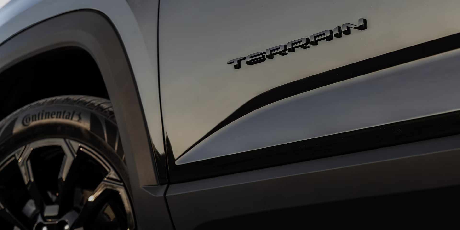 Close-up of Terrain logo on 2025 GMC Terrain SUV