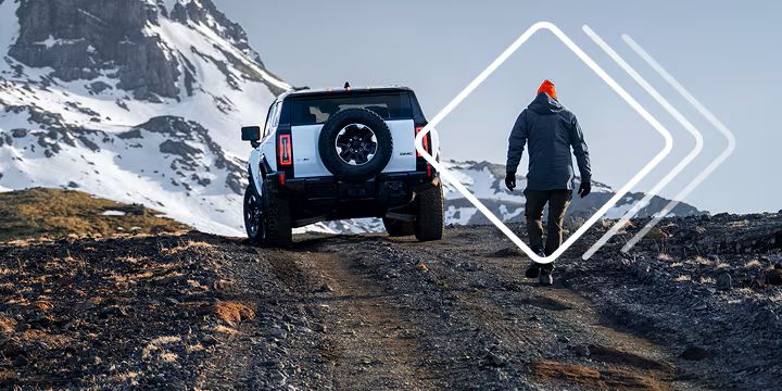 Man with GMC SUV outside