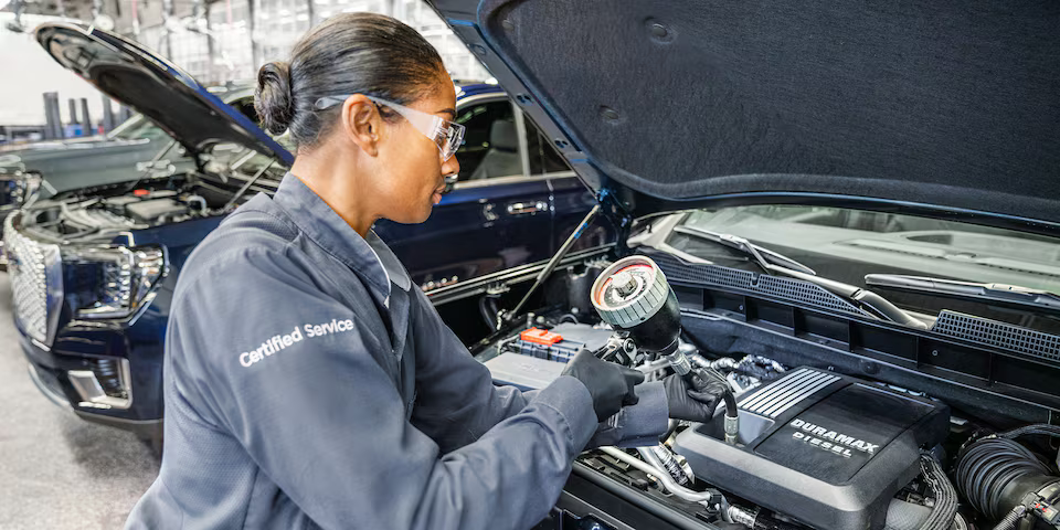 GMC oil change image with technician