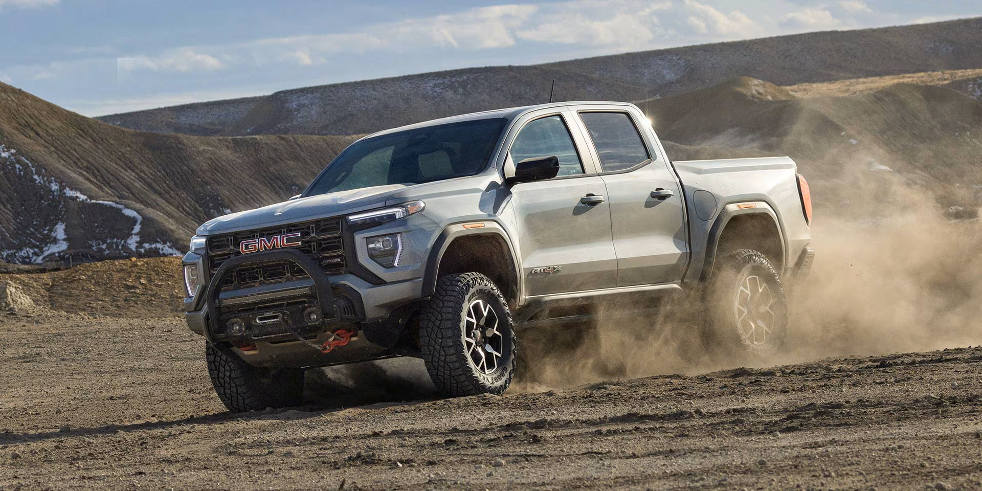2026 GMC Canyon pickup truck kicking up dirt
