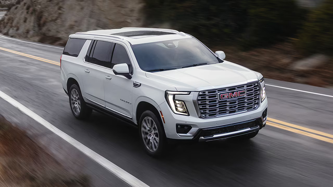 White 2026 GMC Yukon on the road