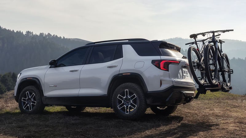 2027 GMC Terrain parked outside with bikes on the back